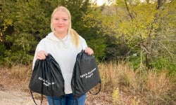 Kayla Leeper with her kindness bags.