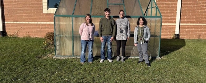 Cord Akey with teachers and the principal from Country Meadow Elementary.