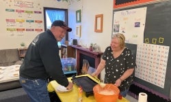 Alumni Members Kim and Donny Thompson making pancakes for the kids.