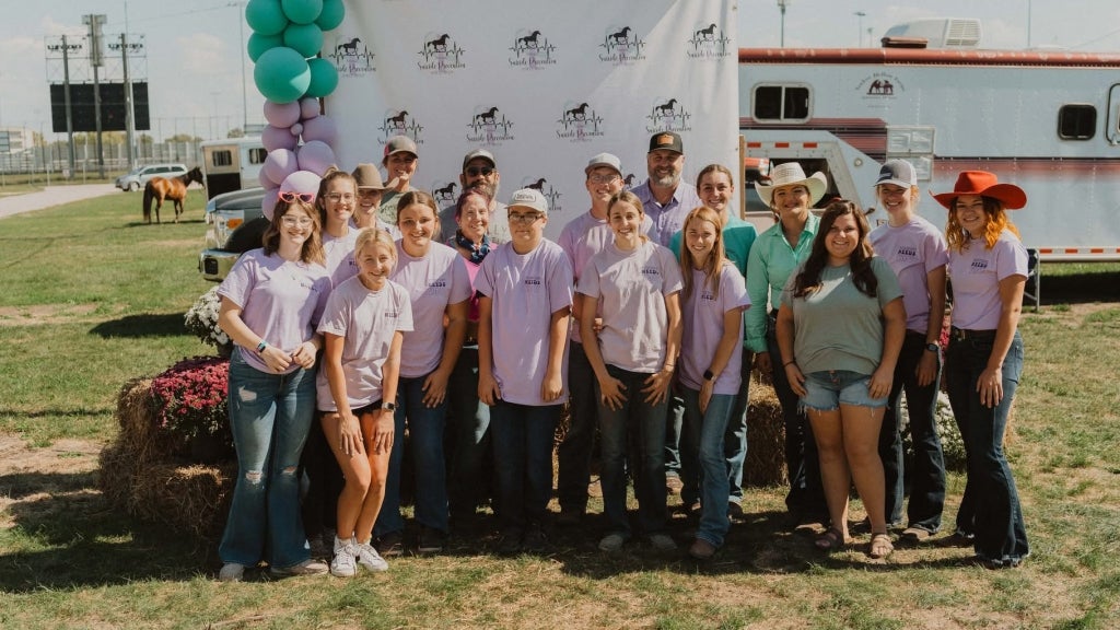 In the past five years, Marley Larson (center) has grown her annual horse show to raise funds for suicide prevention and mental health awareness. Photo courtesy of Marley Larson.