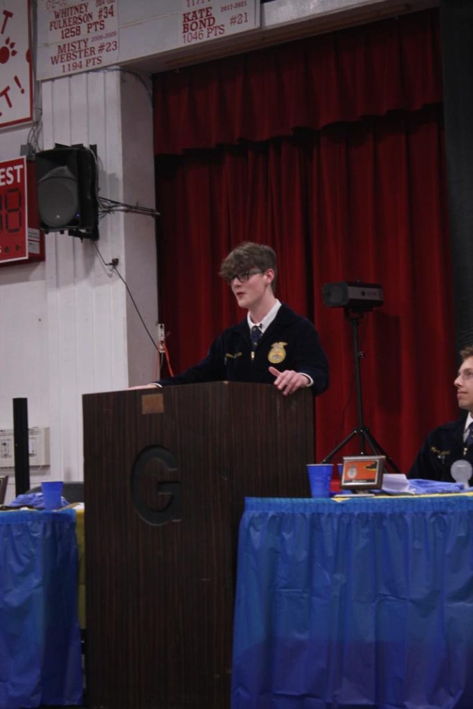 Connor Graham delivers his chapter banquet speech, expressing gratitude for the skills and confidence FFA has given him.
