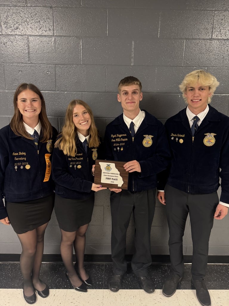 Lanie Bailey, Maycee Thouvenel, Ryatt Haggerman and Drake Schmidt hold their first-place agricultural communications plaque.