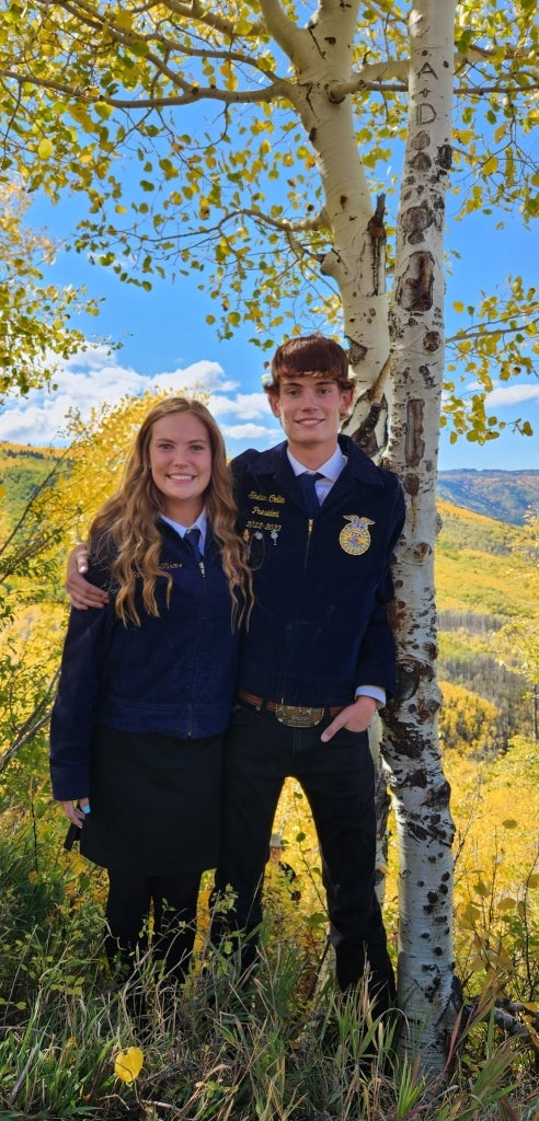 Madison Collin and Sheldon Collin smile in their Official Dress.