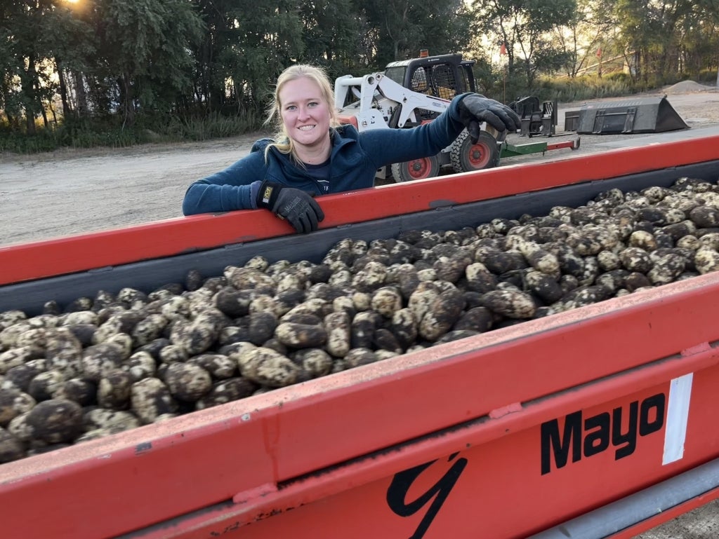 Katie Vculek works at her family’s potato warehouse during harvest. Photo courtesy of Katie Vculek.