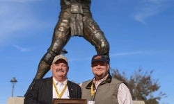 L to R Brandon and Jake Devine pose for a picture after receiving his honorary American degree.