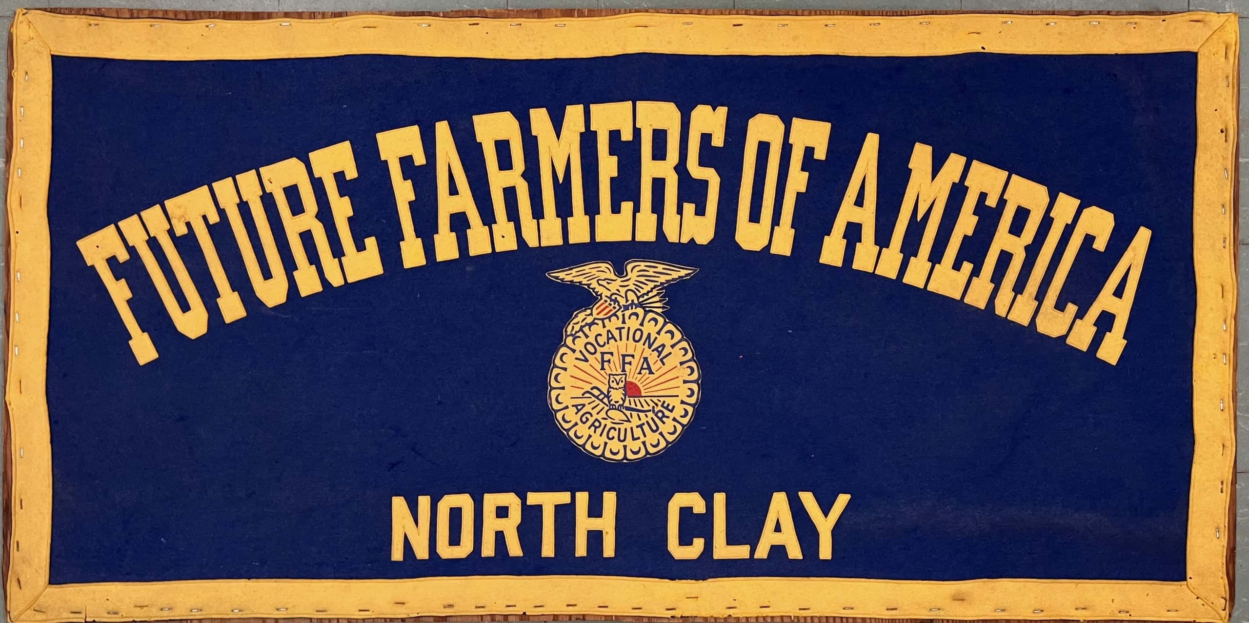 The vintage FFA sign found by Van Dyke is hung up after being cleaned of its dust and debris.