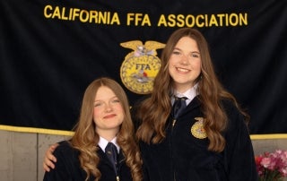 Reanna McLoughlin and Morgan Darrow pose for camera