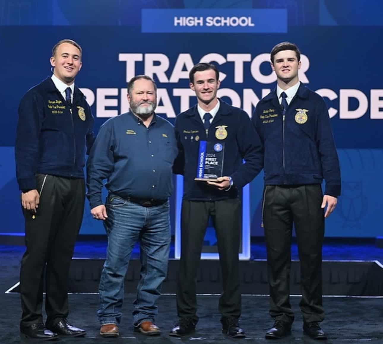 Spencer is presented with the State Champion CDE Award for Tractor Operations & Mechanics.