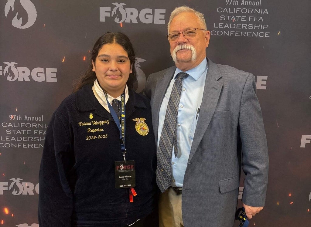 FFA in the USA Reporter Viviana Velazquez with Charles Parker, who is retiring as California’s state FFA advisor.