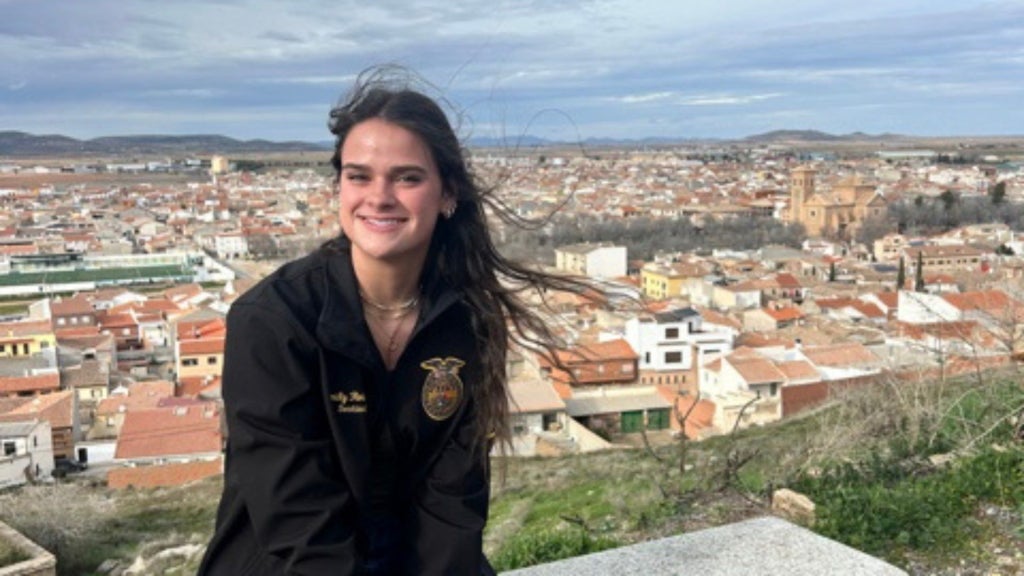 Emily Robbins smiles at an overlook in the city of Consuegra, Spain, where she toured the La Mancha windmills and a castle built in the 10th Century. Photo courtesy of Emily Robbins.