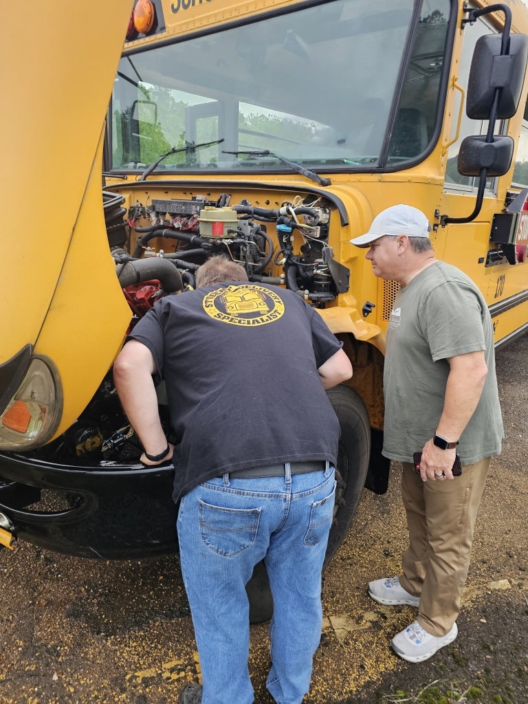 Jason West and Caleb Thompson assess the damage. In this moment, the road to state nearly ended, and the rescue began.
