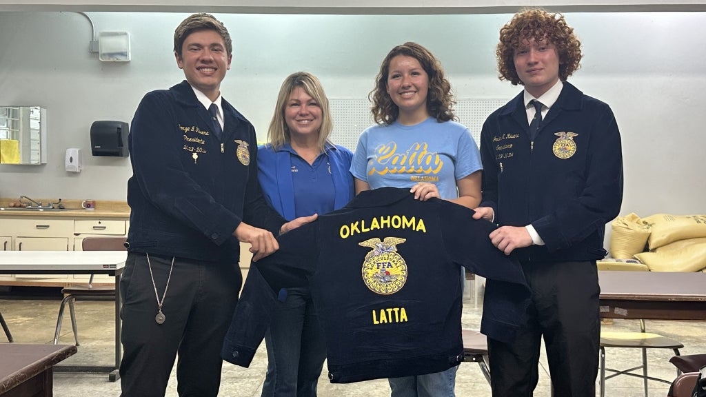 Latta FFA member Jocelyn James (second from right) met two state officers and Puerto Rico FFA Association Executive Secretary Brendaliz Ferrer (second from left) during a visit to agriculture classes in Angeles, Puerto Rico. Photo courtesy of Seth Reeves.