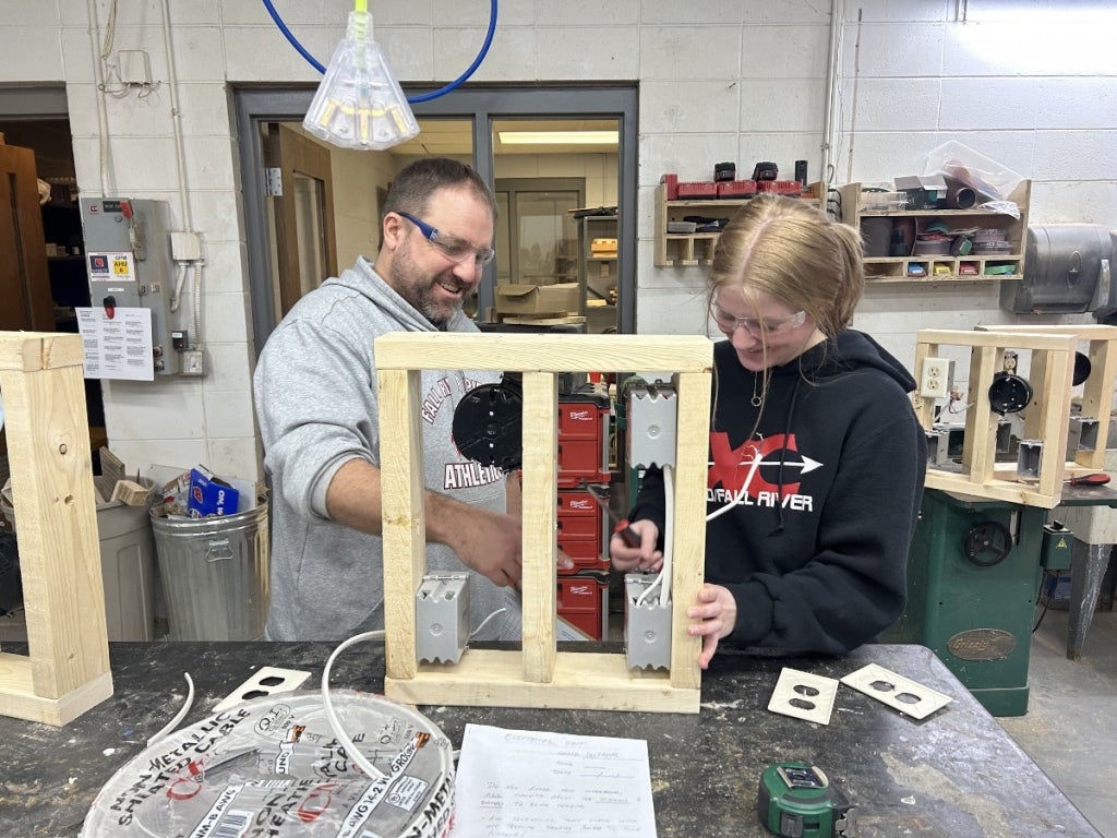 Agricultural and technology education instructor Ryan Christian (left) completes a woodworking project with a Fall River High School student (right). Photo courtesy of Christine Lindner.