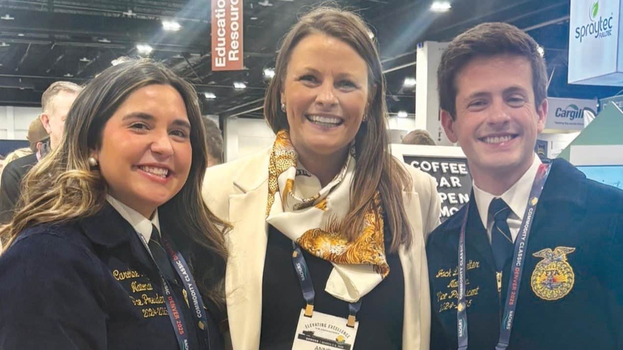 Anne Thompson with FFA vice presidents Caroline Groth and Jack Lingenfelter.