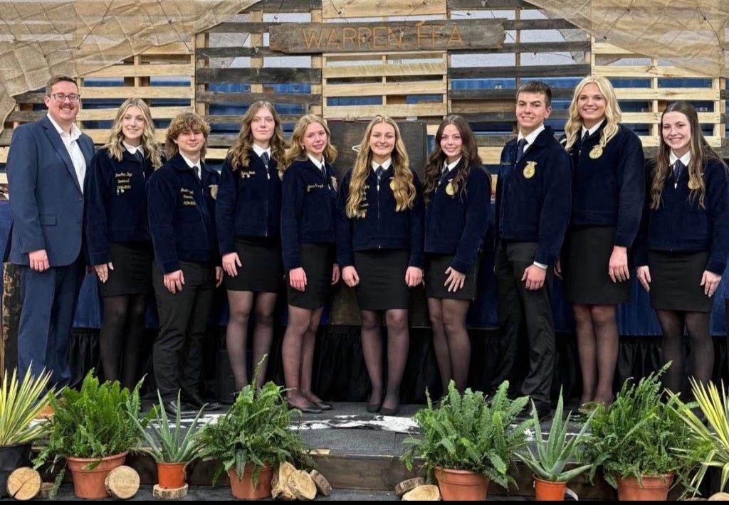 Boyer stands next to her 2025-26 chapter officer team.