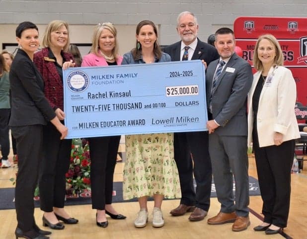 Kinsaul (middle) accepts her Milken Educator Award during a school assembly. Photo courtesy of Rachel Kinsaul. 