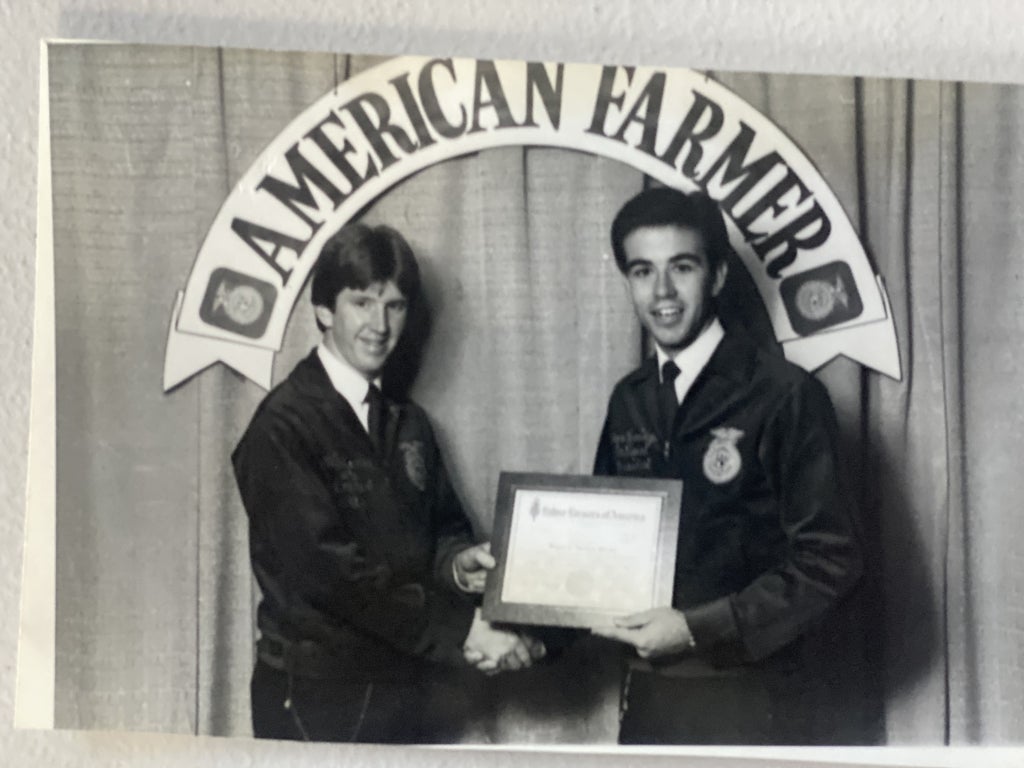 Michael Torrey (left) receives his American FFA Degree, the highest degree awarded to FFA members. Photo courtesy of Michael Torrey/Torrey Advisory Group.