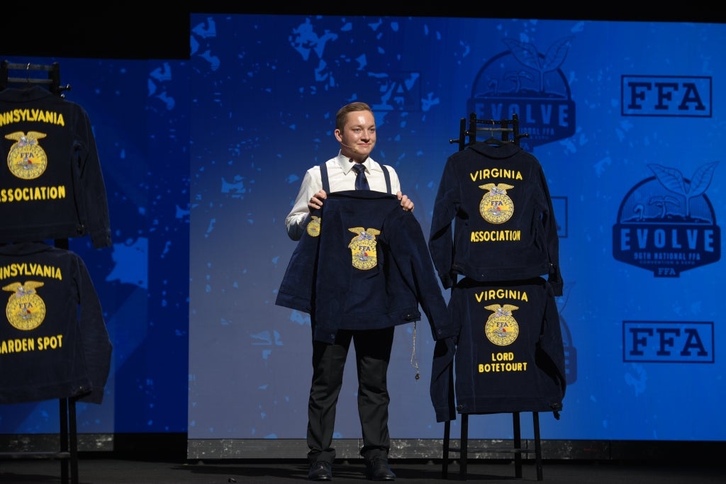 Andrew Seibel retires his national officer jacket during the 96th National FFA Convention & Expo, symbolizing the completion of his year of service.