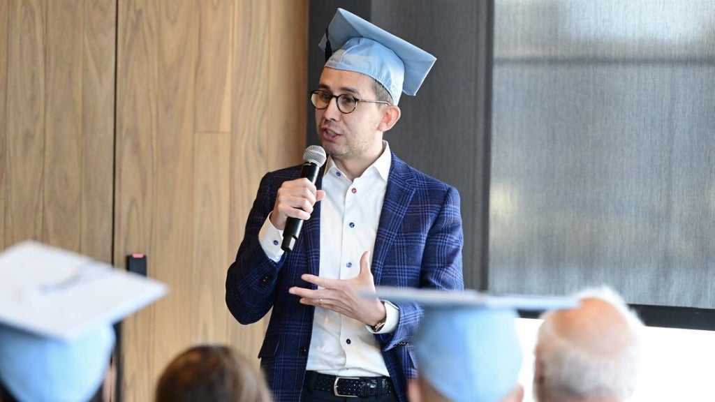 Thomas Sanchez speaks at his graduation from the Columbia Business School. Photo courtesy of Thomas Sanchez and Leslie Albrecht.