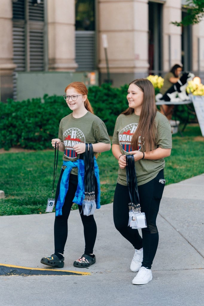 Bassett FFA members pass out lanyards to participants of the stair climb.