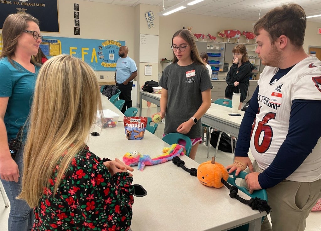 FFA members teach ECS students about animal care.