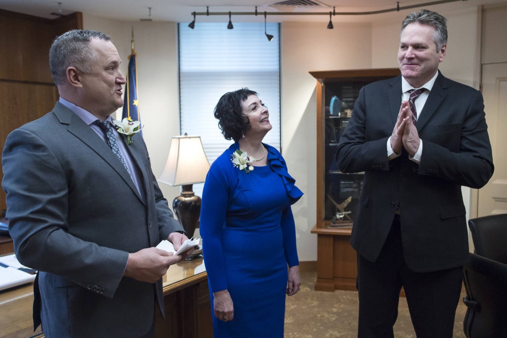 Senator Mike Shower, Wasilla (left), and Senator Shelley Hughes, Palmer (center), relay a message to Gov. Michael J. Dunleavy (right) in his Capitol office that the Senate is open and ready for business on the first day of the 31st Session of the Alaska Legislature on Tuesday, Jan. 15, 2019. (Photo by Michael Penn | Juneau Empire.)