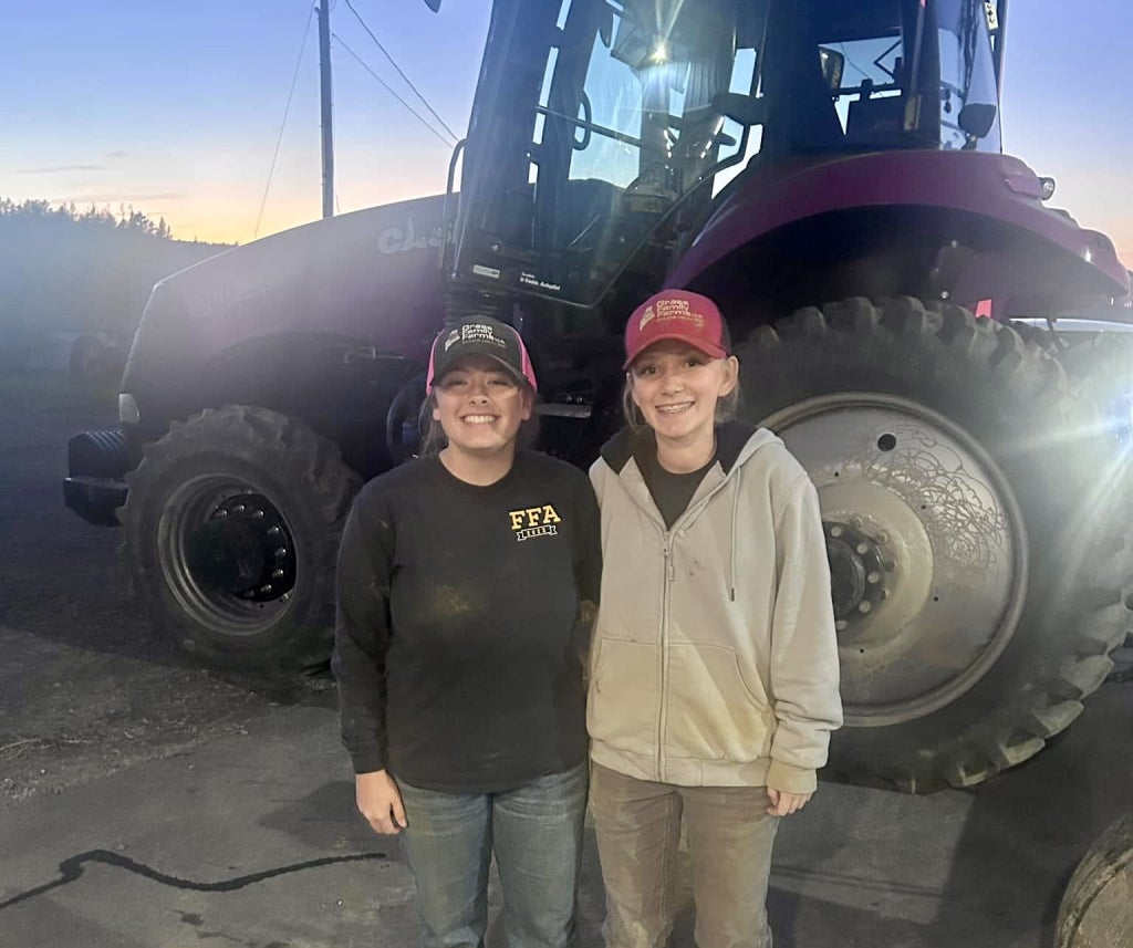 Mars Hill FFA members Rebecca Shaw and Jillian Grass work for Grass Family Farms.