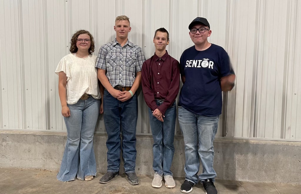 Callie Rosner (far left) poses with students participating in the Cheyenne Warrior Goat Program.