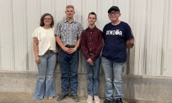 Callie Rosner (far left) poses with students participating in the Cheyenne Warrior Goat Program.