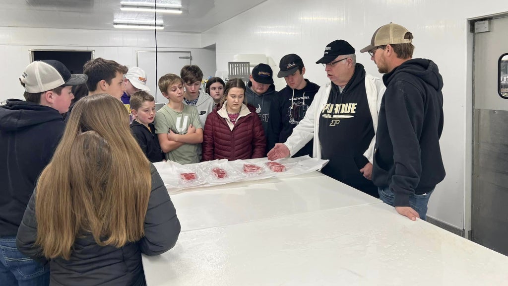 After he retired from teaching, Roger Carr (second from right) helped Central Noble FFA prepare for the Denver meats evaluation career development event. Photo courtesy of Roger Carr.