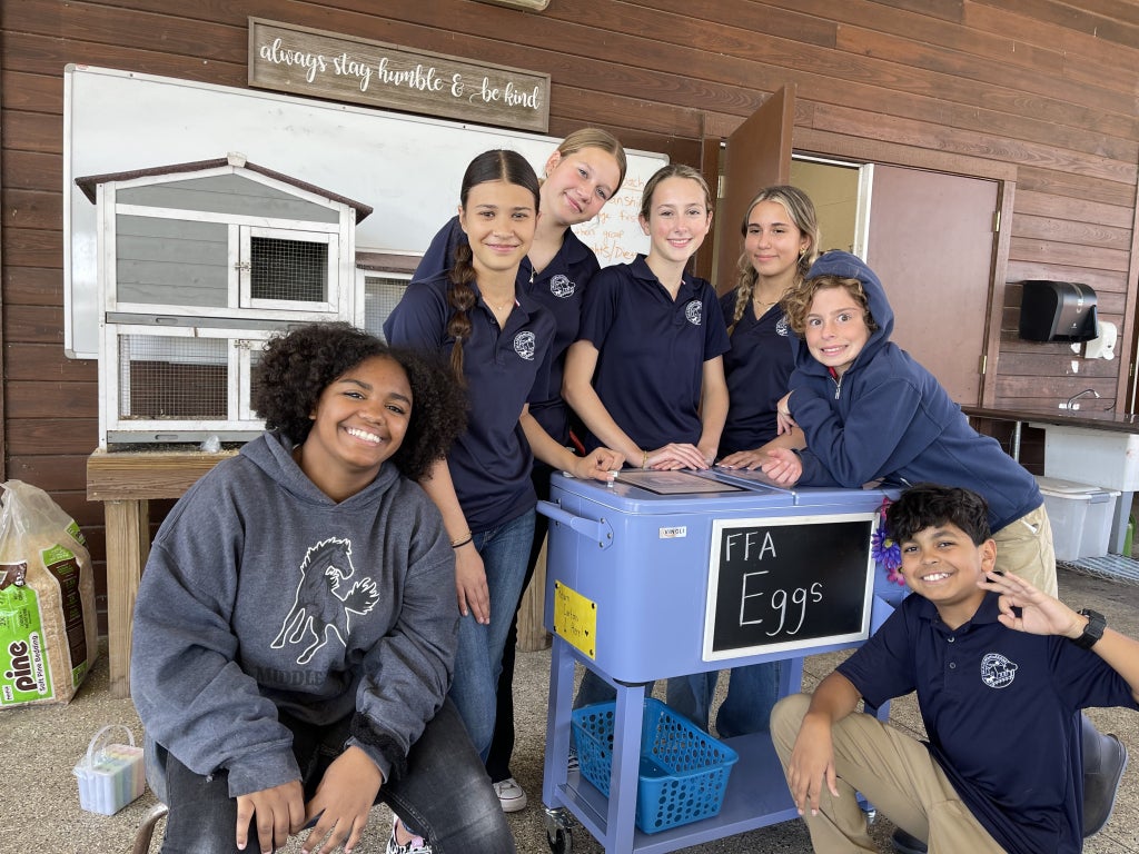FFA members prepare the mobile egg stand for the afternoon market. They sell eggs to their school’s staff members. Photo courtesy of Robin Carter.