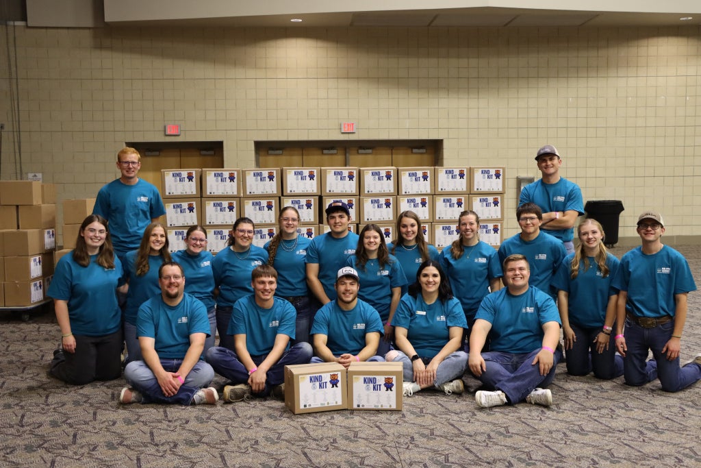 Participating members and state officers smile with completed kits. Photo courtesy of Anna Palmer and Gracie Rauschenberger.