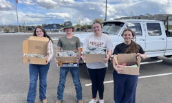 Members of the Cheyenne Frontier FFA Chapter’s Building Communities Committee pose outside of Laramie County Senior Services with care kit components.