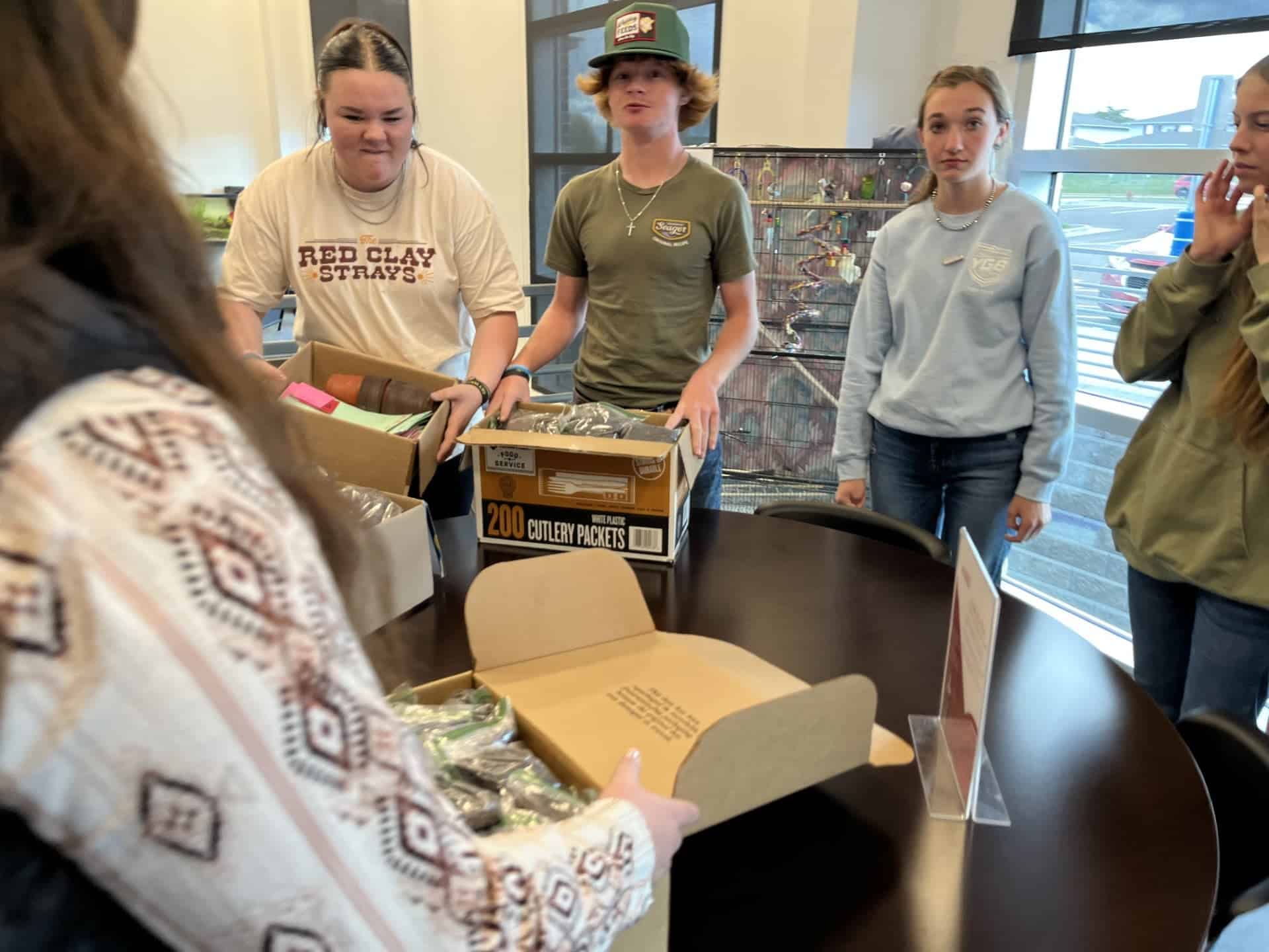 Members deliver care kit components to Laramie County Senior Services.