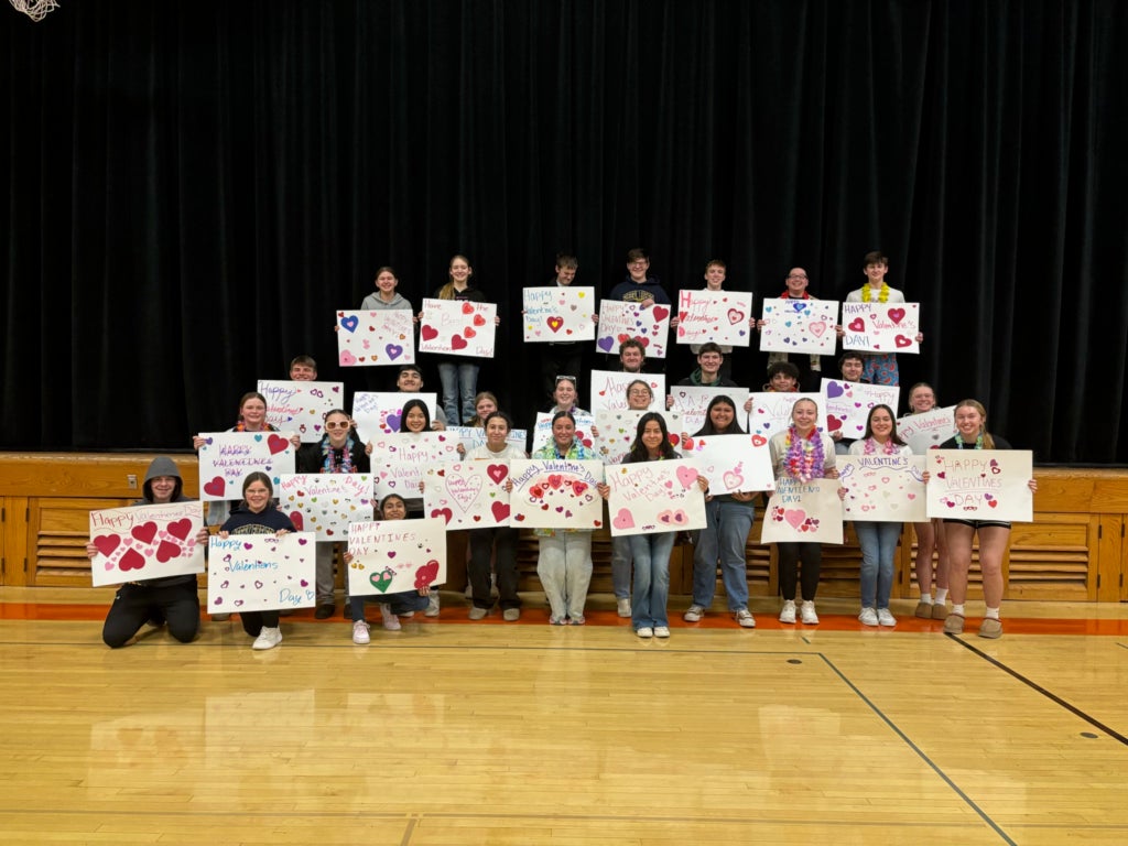 Chapter members show posters made for local nursing homes