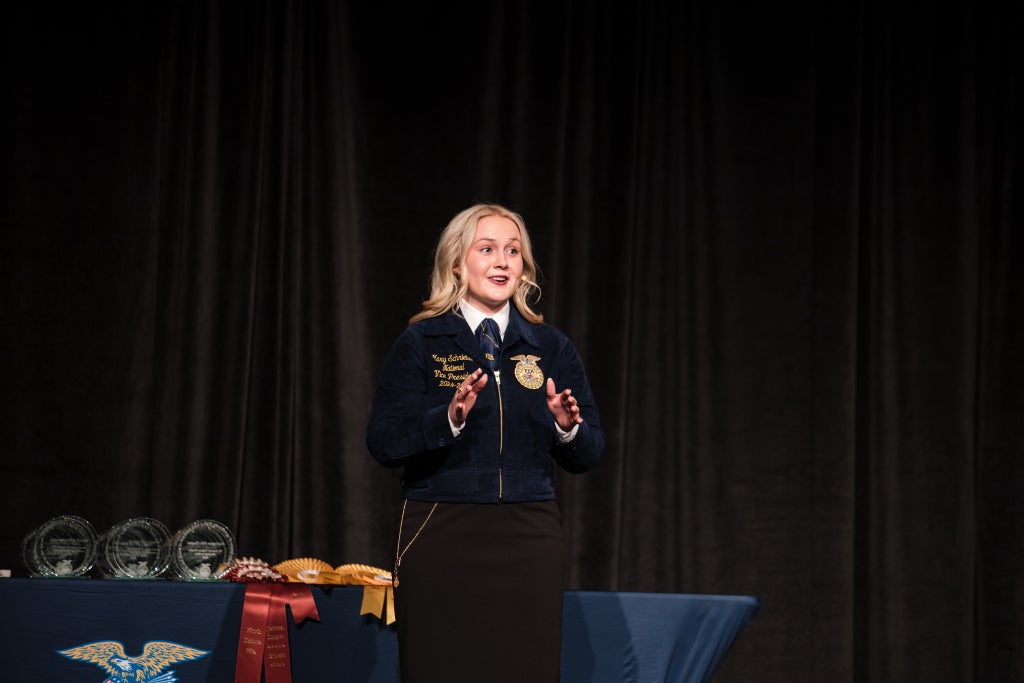 Schrieber gives a speech at a chapter awards banquet.