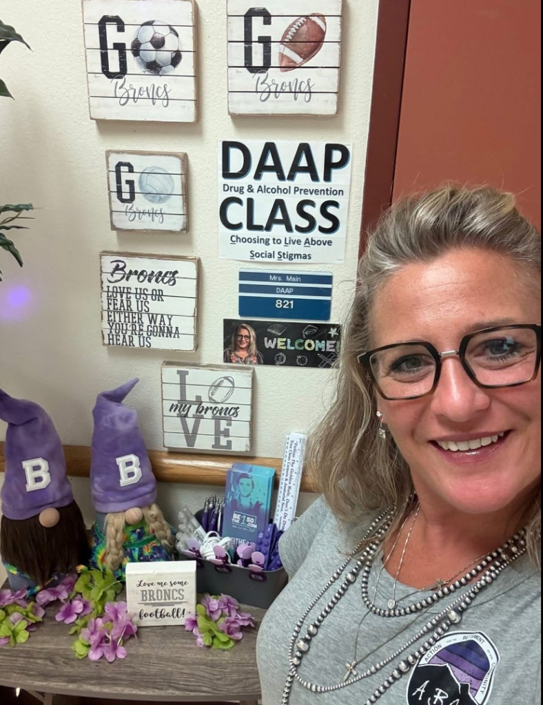 Holly Main outside her classroom. 