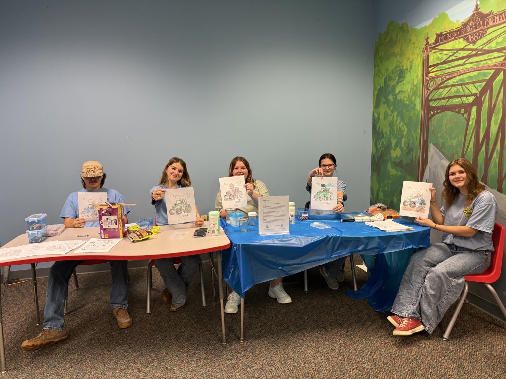 James River FFA members Canaan Clark, Lacey Smith, Abbi Simmons, Lexi Cassell and Harleigh Masters display their tractor coloring pages at the Eagle Rock Library.