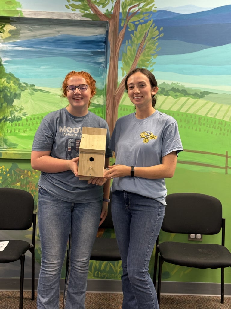Katie Grace Barrett and Kate Chilcott display their example birdhouse.