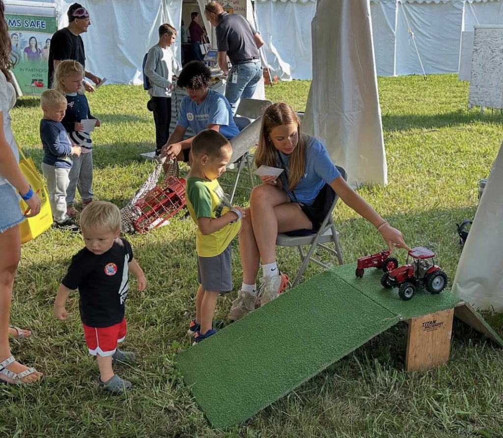 Sleepy Eye FFA member Elsie Trebesch teaches kids about tractor safety