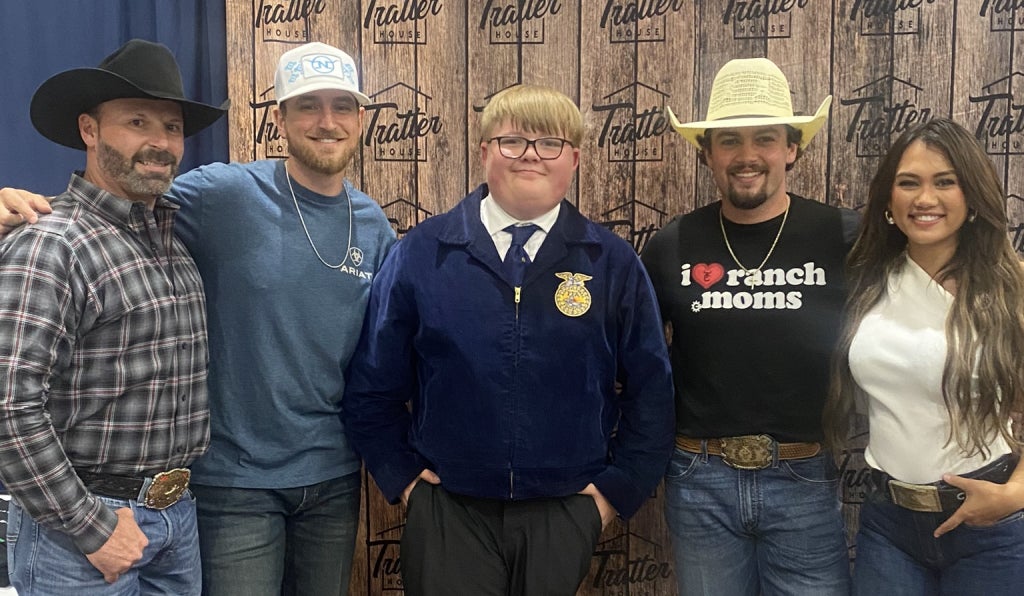 Carter Coble (middle) proudly represents Sapulpa FFA at the Oklahoma State FFA Convention, showcasing leadership and commitment to service.