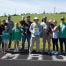 Coach Brown stands with his family and friends at Barnesville HS during a track recognition event.