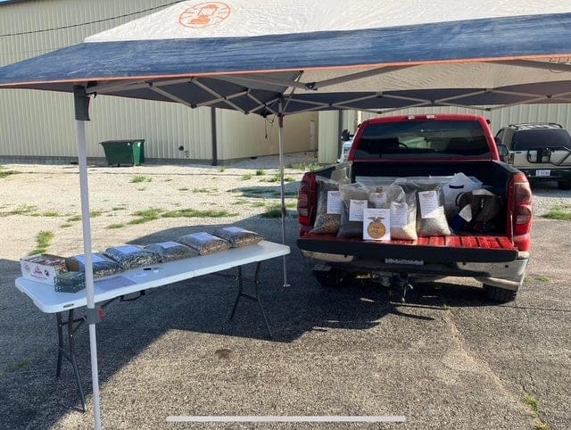 Davs sells his SAE products at a farmers market.