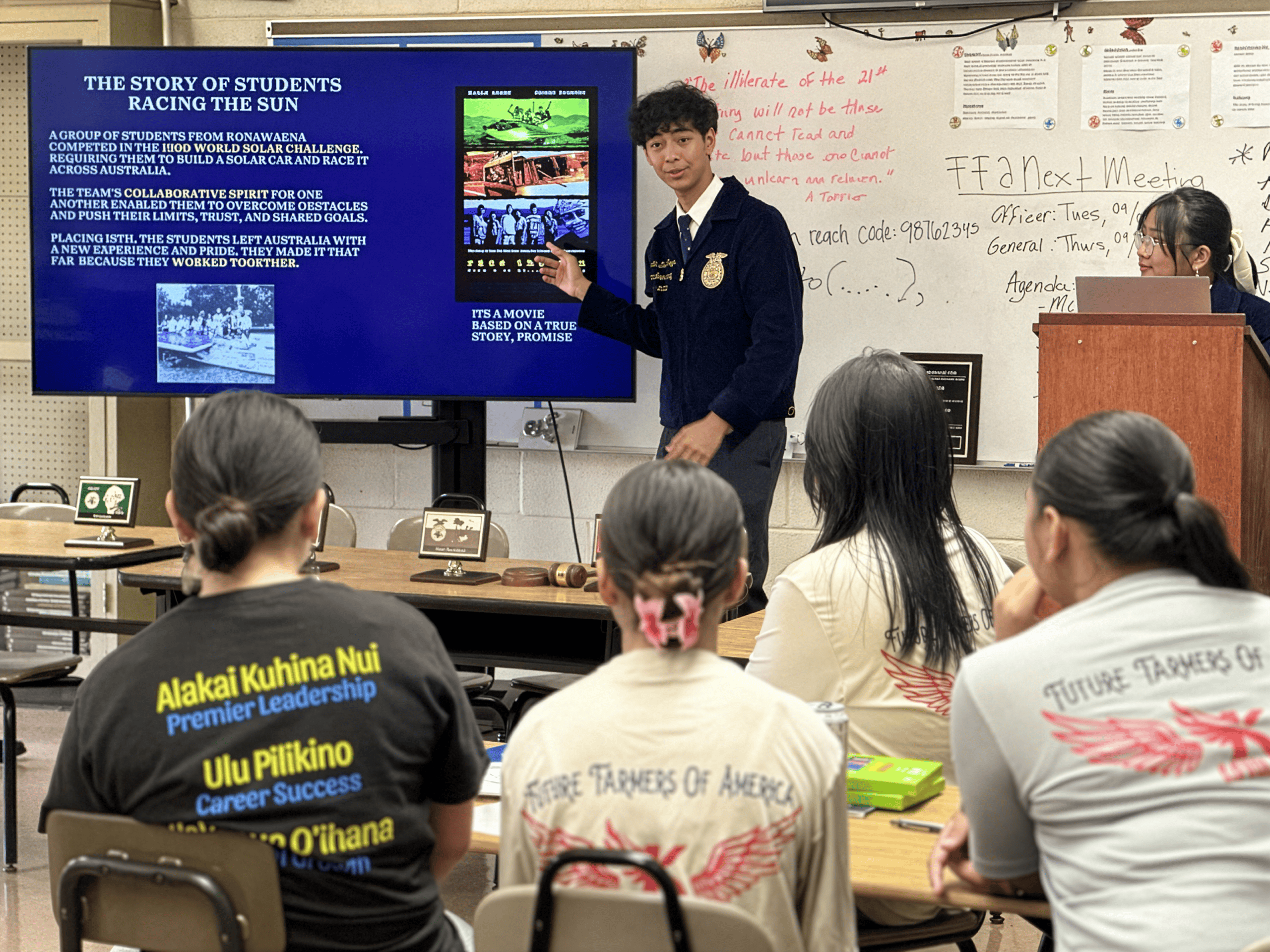 Jordan presenting a slideshow at a leadership workshop.