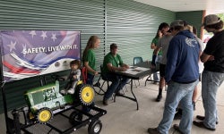 FFA members gave presentations to farmers as they came by about various common farming accidents and how to prevent them. This exhibit was about tractor rollover safety.