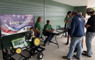 FFA members gave presentations to farmers as they came by about various common farming accidents and how to prevent them. This exhibit was about tractor rollover safety.