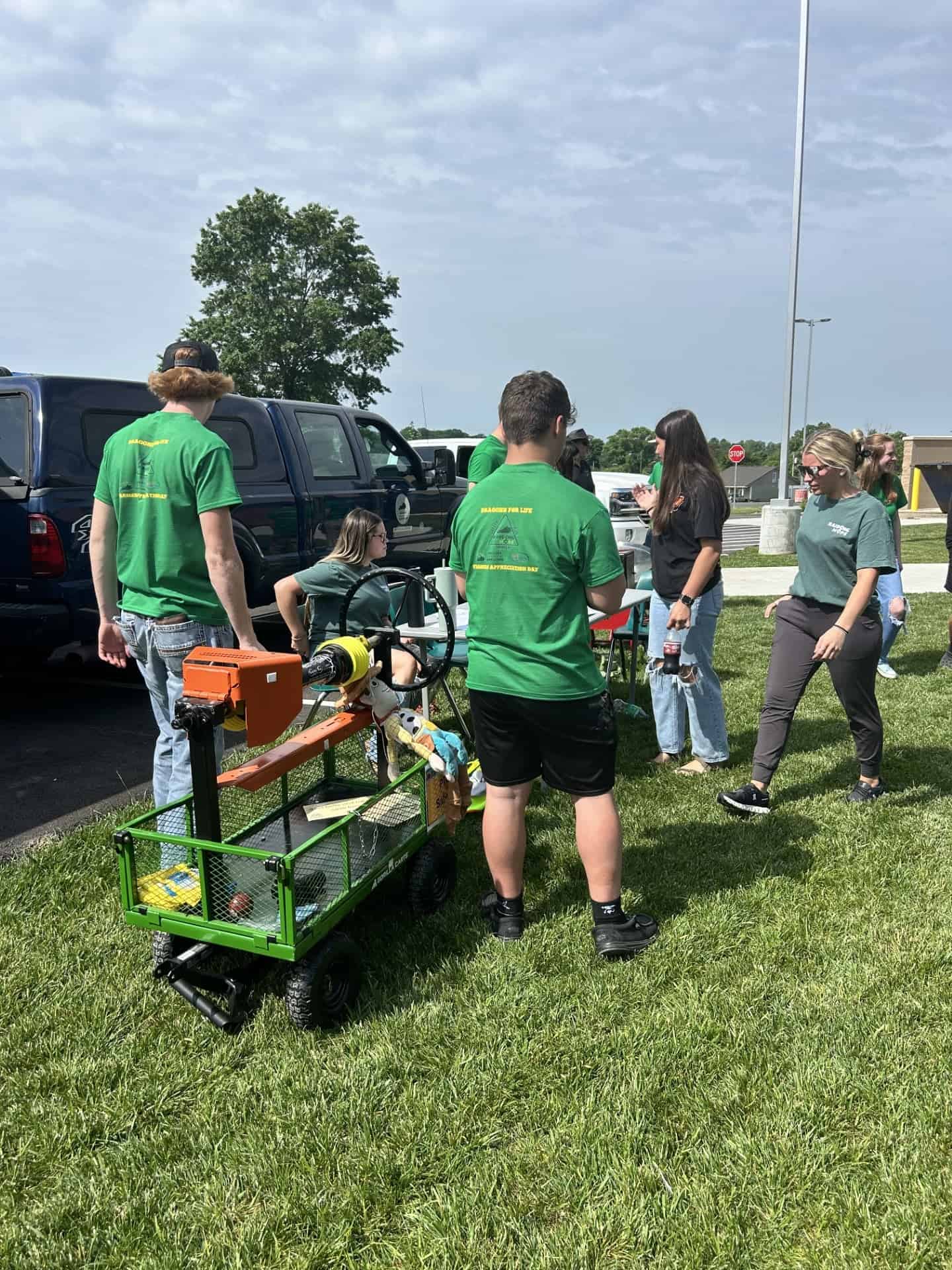 Agriculture students and FFA members prepare before the event by setting up a PTO safety exhibit and finalizing their presentation.