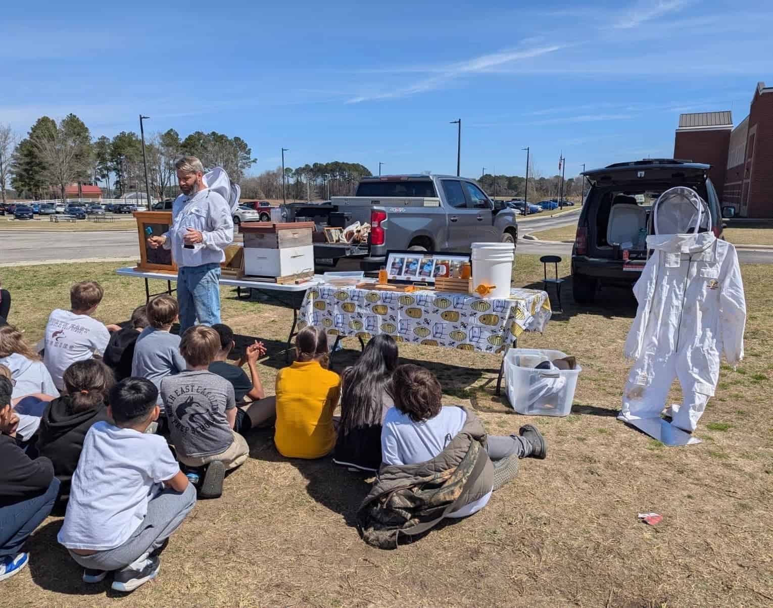 Journeyman Beekeeper Ted Williamson provides elementary students with insights into the world of Bees at NECP.