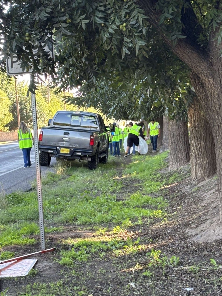 Las Cruces FFA members clean their designated area.