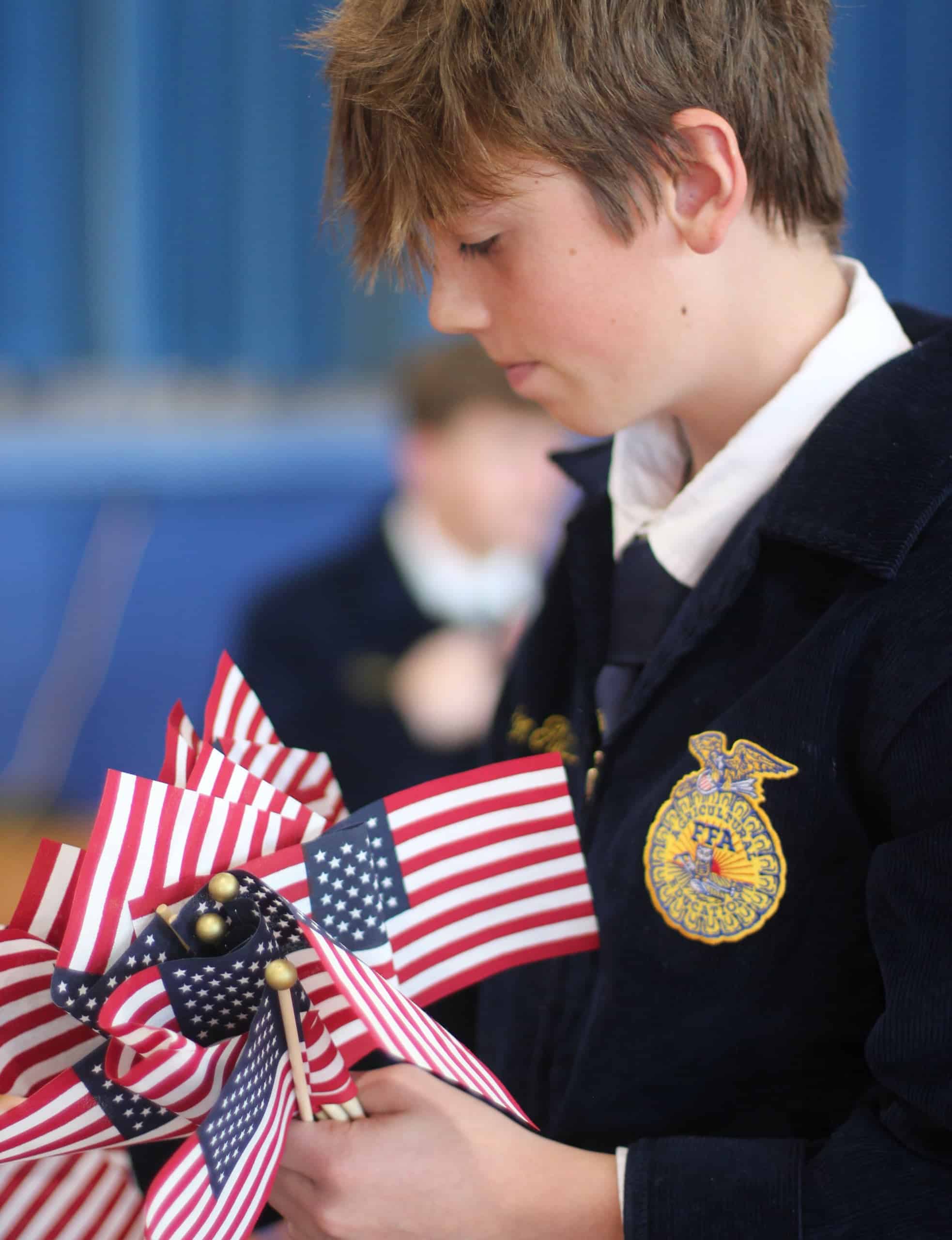 Landon Gladhill, Atlanta FFA Member, prepares for their annual Veterans Day presentation. 